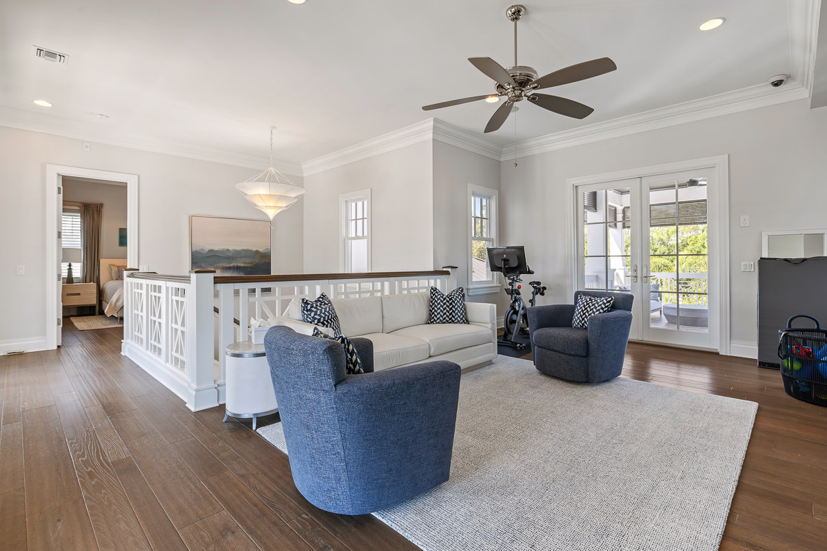 loft at top of stairs with blue and white furniture